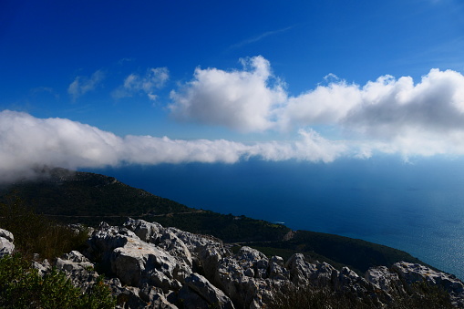 Clouds over the sea from the Grande Corniche park, path between the Fort de la Revère and the Cime de la Forna, Côte d'Azur, Alpes-Maritimes