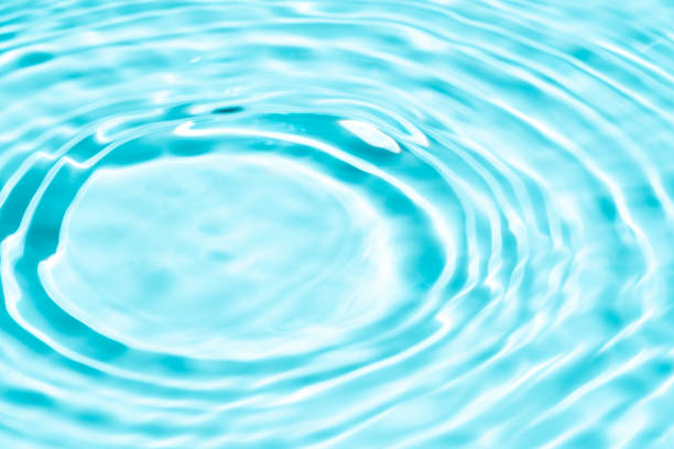 istock Background summer natural blue texture, clear water with ripples and splashes. Water waves in sunlight with leaf shadow, and background concept of cosmetics, moisturizer, and toner 2029875598
