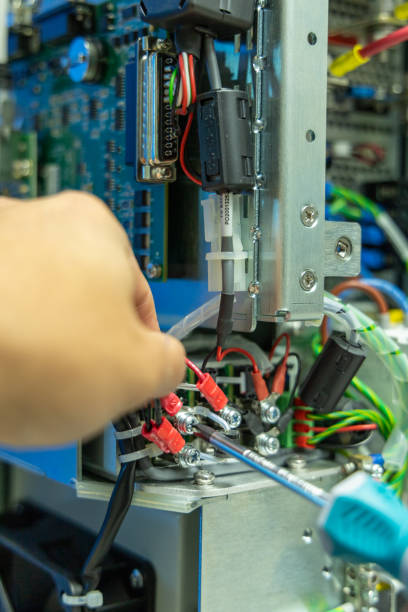 istock Man's hand repairing an electronic board 2029895005