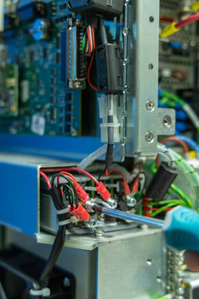 istock Man's hand repairing an electronic board 2029895010