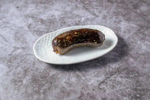 Photo of typical argentinian black pudding, grilled