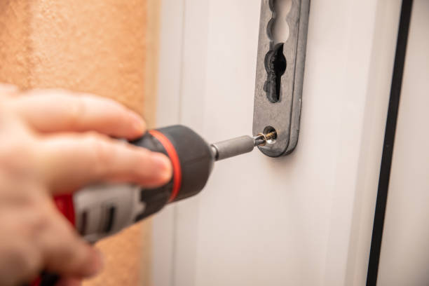 istock craftsman uninstalling a panel or door mounting, maybe key escutcheon 2029922544