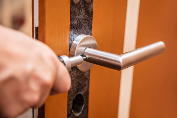 istock craftsman uninstalling a panel or door mounting, maybe key escutcheon 2029923071
