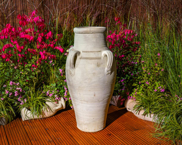 istock Clay Amphora Ceramic Terracotta Pots at flowers decorations background 2029930964