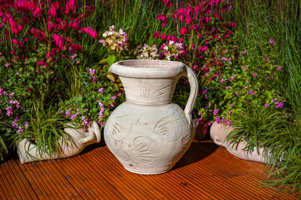 istock Clay Amphora Ceramic Terracotta Pots at flowers decorations background 2029935184