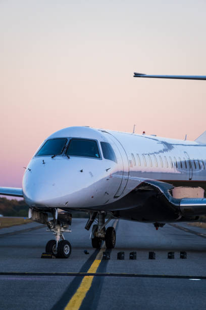 istock Small Jet Airplane on Runway at Sunset 2029938993