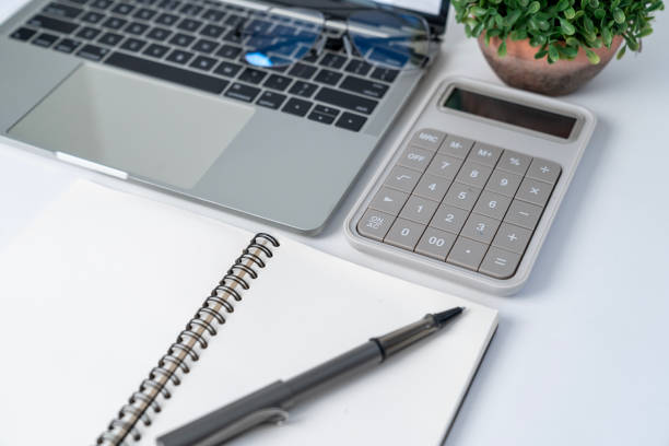 istock A calculator, a wallet, and a laptop computer on the work desk 2029944333