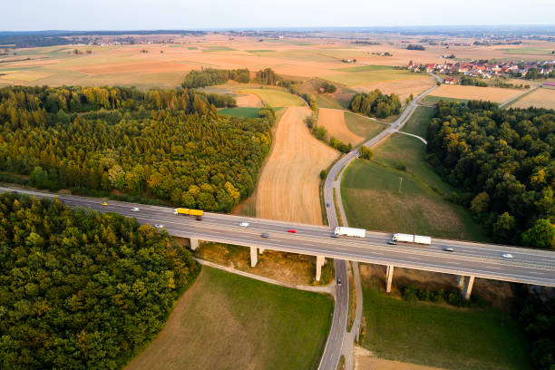 istock Rural highway at sunset, aerial view 2029954018