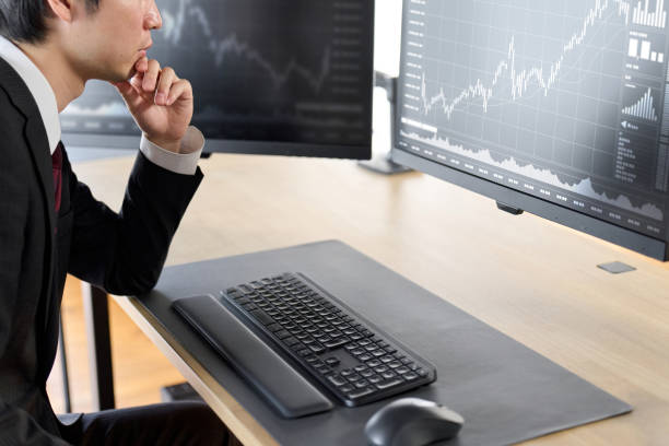 istock Hand of a businessman checking stock prices 2029961075