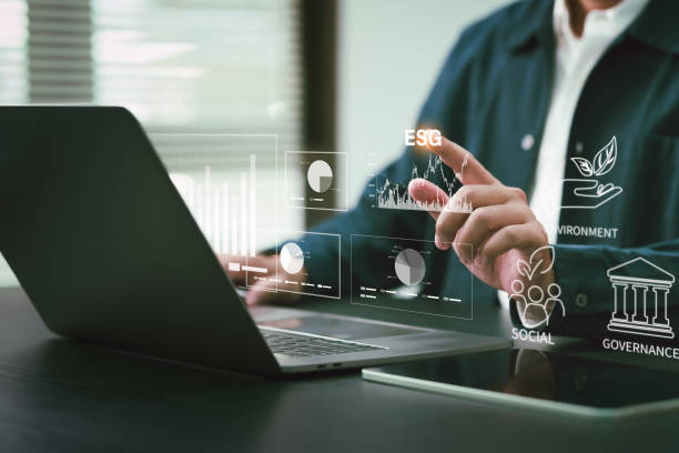 istock E.S.G. Environment, Social and Governance. Businessman analyzes graph on environmental investment and carbon neutrality For the long-term sustainability of the company. 2029966545