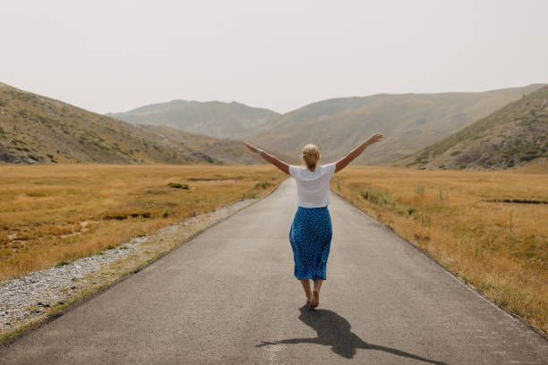 istock Sunlit Stroll: Embracing Freedom on the Open Road 2029968155