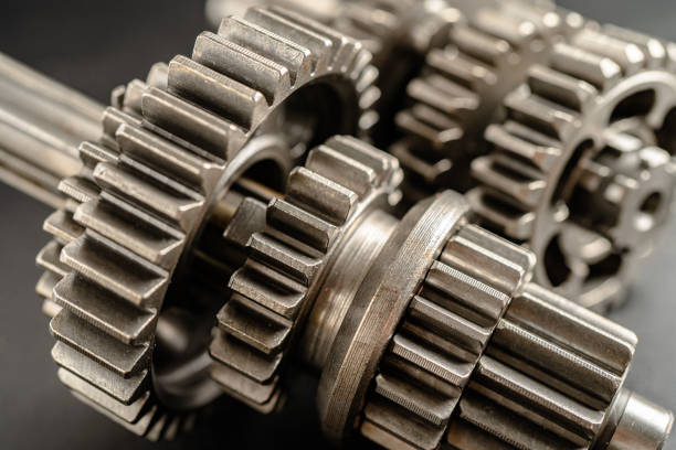 Gear and cogs wheels, clock mechanism, brass metal engine industrial.