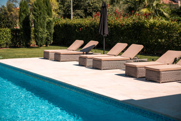istock Private Pool and Elegant Sunbeds on Stone Terrace 2029982679