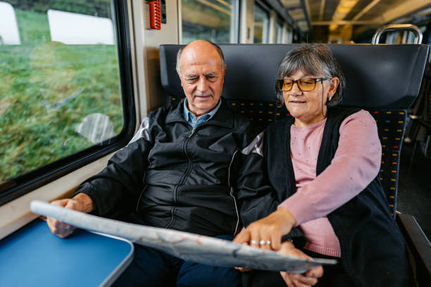 istock Senior Couple Reading A Map While Riding In A Train In Switzerland 2029993911