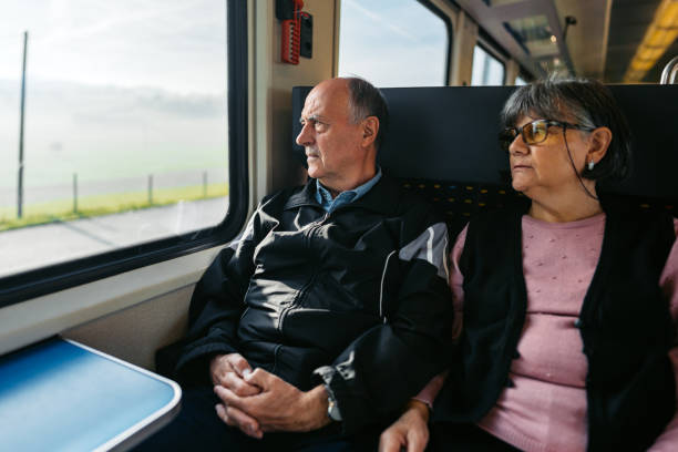 istock Senior Couple Riding In A Train In Switzerland 2029995987