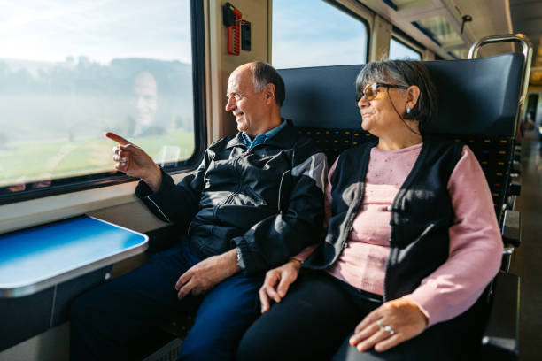 istock Senior Couple Riding In A Train In Switzerland 2029997044
