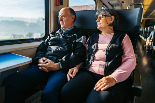 istock Senior Couple Riding In A Train In Switzerland 2029998618