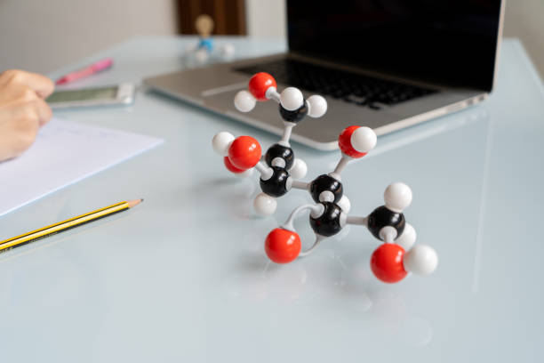 Close-up molecular model of fructose structure during chemistry class. 3D Fructose chemical formula.
