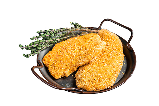 Homemade raw breaded German Weiner Schnitzel.  Isolated on white background