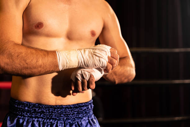 istock Caucasian boxer portrait wrapping his hand. Impetus 2030033092