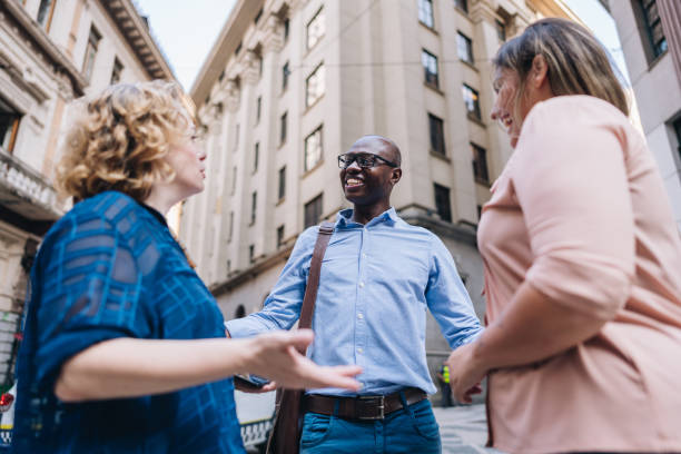 istock Coworkers talking in the street 2030037038