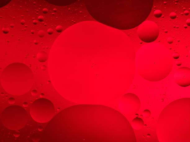 istock Crimson Oil Droplets on Water Surface 2030037596