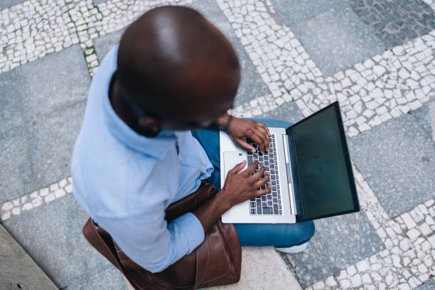 istock Businessman using the laptop outdoors 2030038186