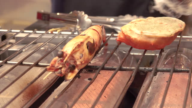 View of shrimp and crab grilled on a charcoal brazier