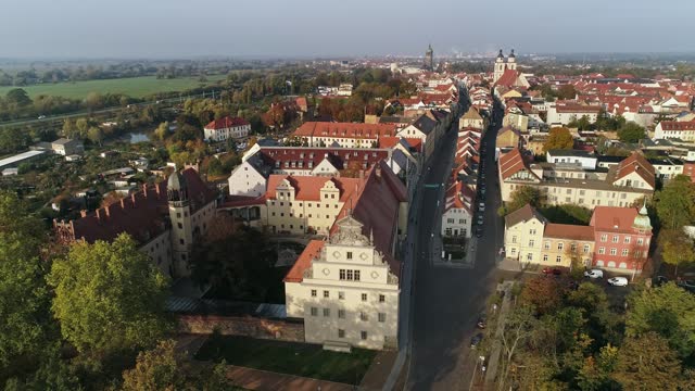 City view with luther house Wittenberg in the foreground and the town church of St. marien, wittenberg church in the background