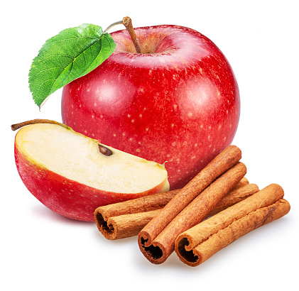 Red apple, apple slice and cinnamon sticks isolated on white background.