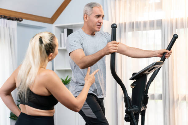 istock Active senior couple running on elliptical running machine. Clout 2030065811