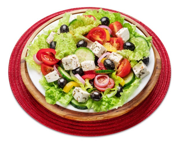 istock Greek salad on white plate isolated on white background. 2030065819