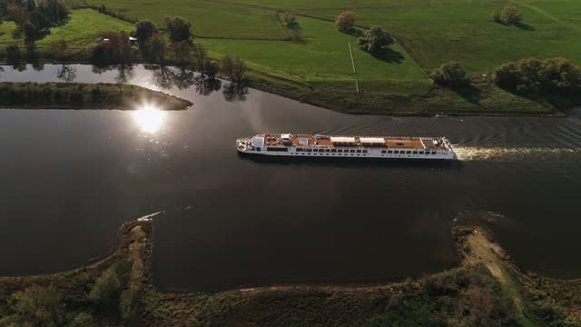 excursion boat at sunset. reflection on the water. river elbe near wittenberg