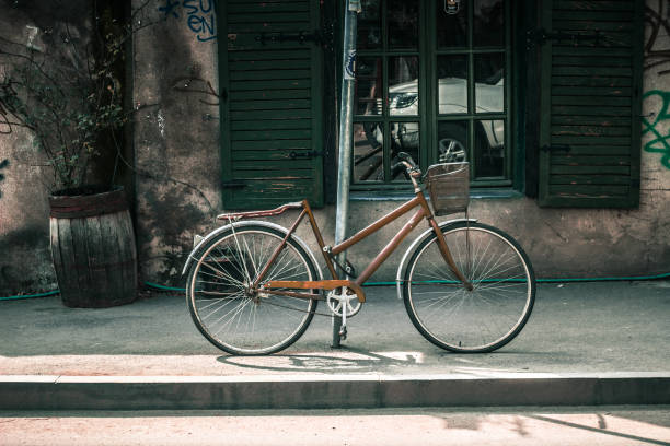 bicycle standing on the post in the street , Tbilisi , Georgia