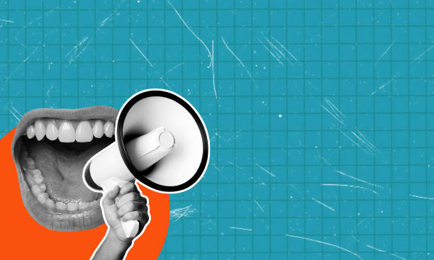 istock A human hand with a megaphone and a female open mouth on a blue background. Modern design, modern art collage. 2030114098