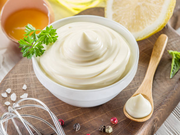 istock Homemade mayonnaise with ingredients and herbs. 2030116265