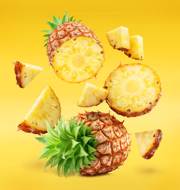 istock Ripe pineapple  and pineapple slices isolated on white background. File contains clipping path. 2030117353