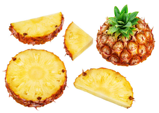 istock Ripe pineapple  and pineapple slices isolated on white background. File contains clipping path. 2030117372
