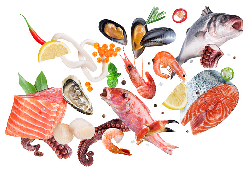 Fresh seafood, fish and seasonings levitating on white background. File contains clipping path.