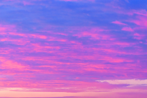 Sky in the pink and blue colors. effect of light pastel colored of sunset clouds\ncloud on the sunset sky background with a pastel color
