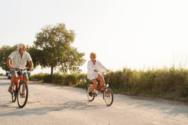 istock Senior couple exploring coastline on a bicycle 2030129645