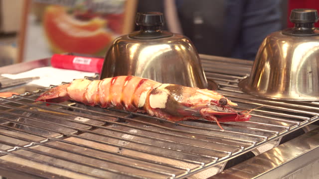 View of shrimp grilled on a charcoal brazier