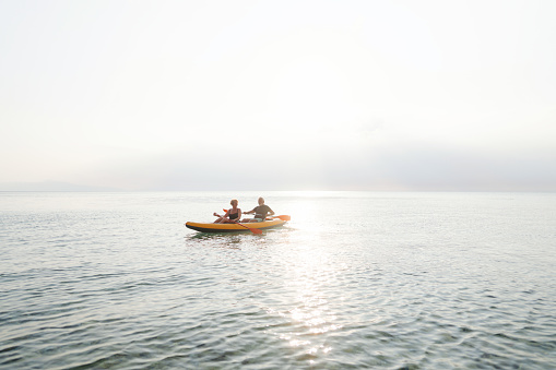 Photo of a senior couple exploring new activities such as kayaking