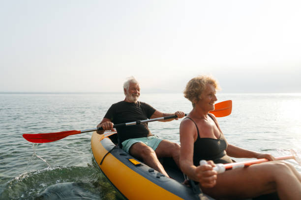 istock Senior couple kayaking at sunset 2030134977