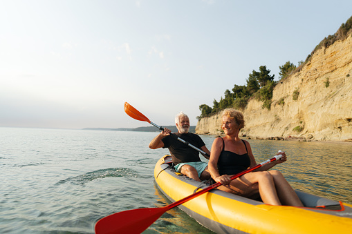 Photo of a senior couple exploring new activities such as kayaking