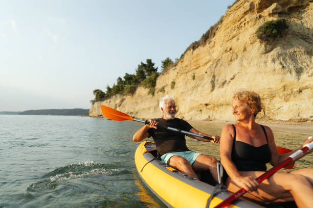 istock Senior couple kayaking at sunset 2030135513