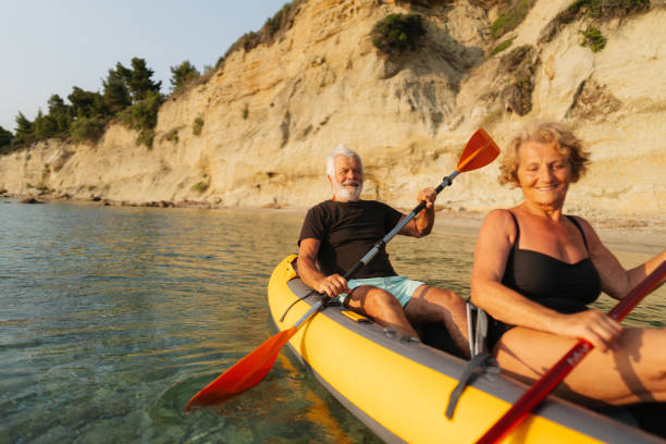 istock Senior couple kayaking at sunset 2030135514