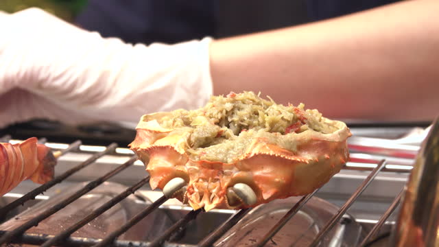 View of crab grilled on a charcoal brazier