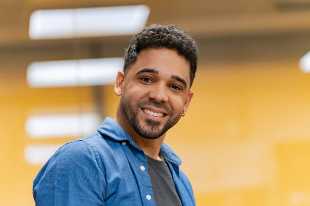 istock Man in blue shirt smiles confidently. 2030154971