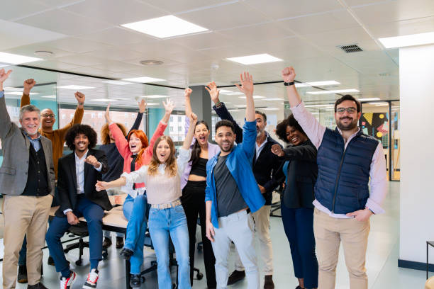 istock Cheerful office team celebrating success. 2030155494